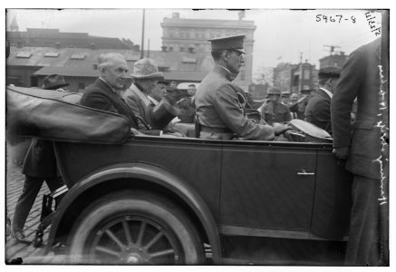 President Warren G. Harding and his wife riding in back of car LCCN2014719658