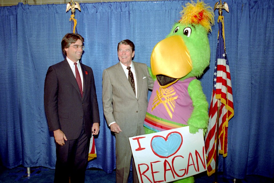 President Ronald Reagan posing for photos with mascot at Indianapolis Convention Center,