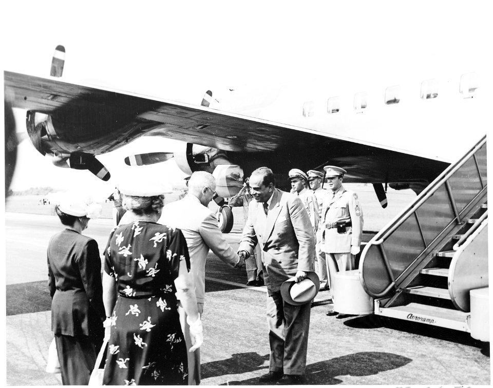 President Truman greets the President of Venezuela, Romulo Gallegos. They are under the presidential airplane, the... - NARA - 199808