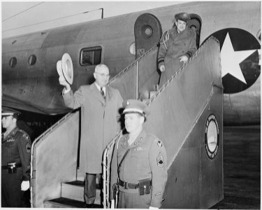 President Truman preparing to go up the stairs into the presidential airplane to leave for vacation in Key West... - NARA - 199671 photo