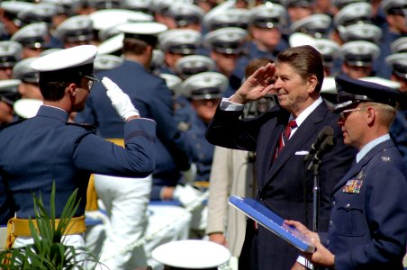 President Ronald Reagan salutes an Air Force Cadet at the United States Air Force Academy