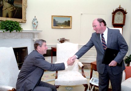 President Ronald Reagan shaking hands with Marlin Fitzwater in the Oval Office