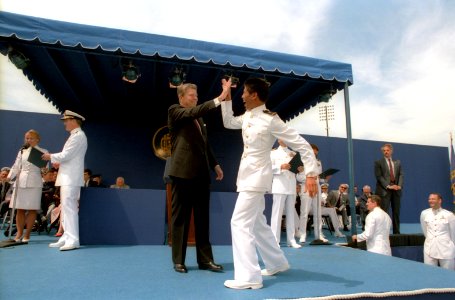 President Ronald Reagan congratulating a Midshipman at the Naval Academy Commencement ceremony