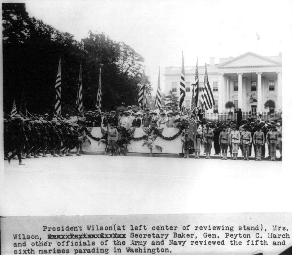 President Wilson, Mrs. Wilson, Secretary (Newton D.) Baker, Gen. Peyton C. March and other officials of the Army and Navy reviewing the fifth and sixth Marines parading in Washington (in LCCN2005686545