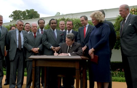 President Ronald Reagan signs Executive Order 12595