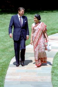 President Ronald Reagan walking with Prime Minister Indira Gandhi of India