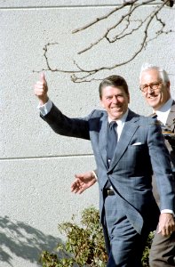 President Ronald Reagan giving the thumbs up sign outside Bethesda Naval Medical Center in Maryland photo