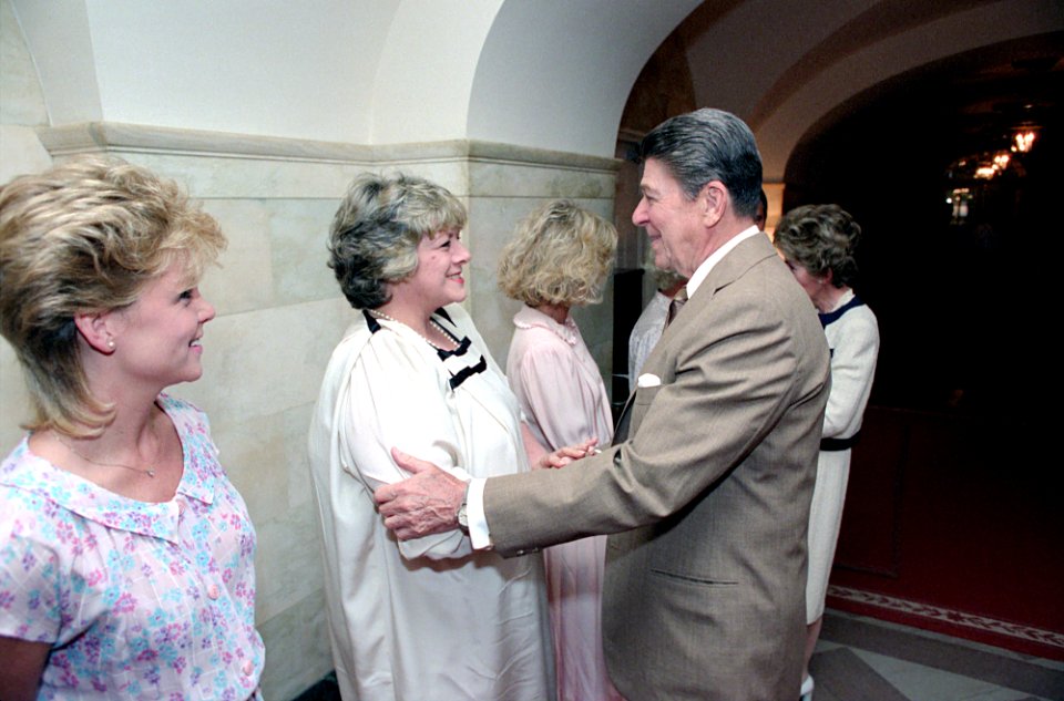 President Ronald Reagan greeting actress Rosemary Clooney with Lisa Hartman