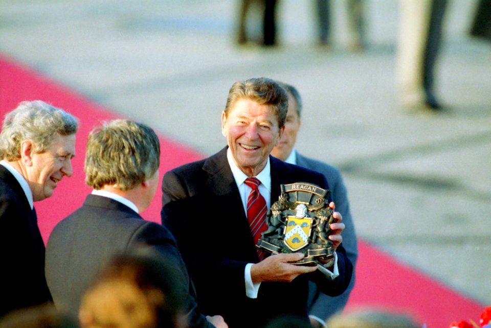 President Ronald Reagan holding his coat of arms during an Arrival Ceremony in Shannon, Ireland