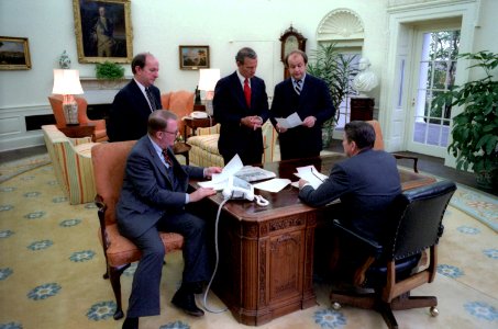 President Ronald Reagan holds an Oval Office staff meeting photo