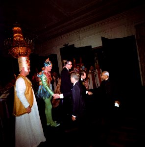 Presidents Kennedy and Radhakrishnan greet actors following an opera at the White House photo