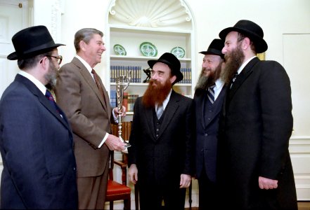 President Ronald Reagan in the Oval Office during a Presentation of Menorah with Rabbi Abraham Shemtov photo