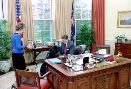 President Ronald Reagan with Nancy Reagan and Dog Lucky in oval office