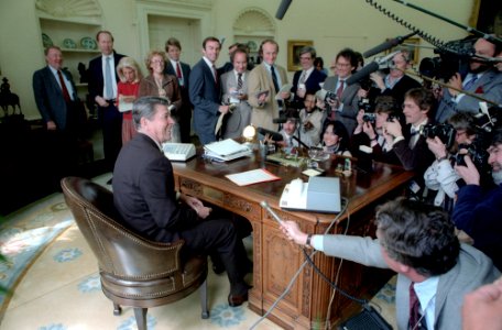 President Ronald Reagan with the press in the Oval Office photo