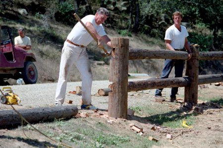 President Ronald Reagan working on a fence with Dennis LeBlanc at Rancho Del Cielo in Santa Barbara, California photo