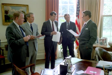 President Ronald Reagan meeting with Ed Meese, James Baker, Bill Clark, and George H. W. Bush in the Oval Office