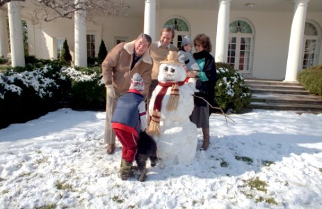 President Ronald Reagan, Cameron Reagan, Michael Reagan, Colleen Reagan and Ashley Reagan building snowmen in Rose Garden