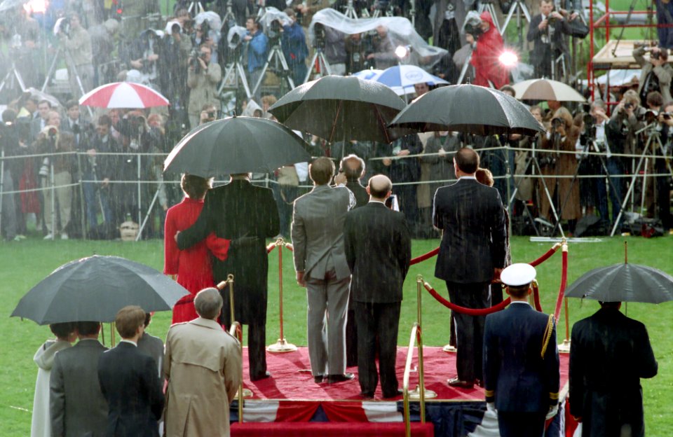 President Ronald Reagan, Mikhail Gorbachev, Nancy Reagan, Raisa Gorbachev, and Pavel Palazchenko attend the departure ceremony on the South Lawn