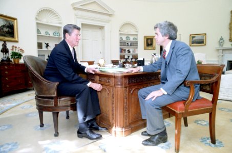 President Ronald Reagan meeting with Martin Anderson in the Oval Office photo