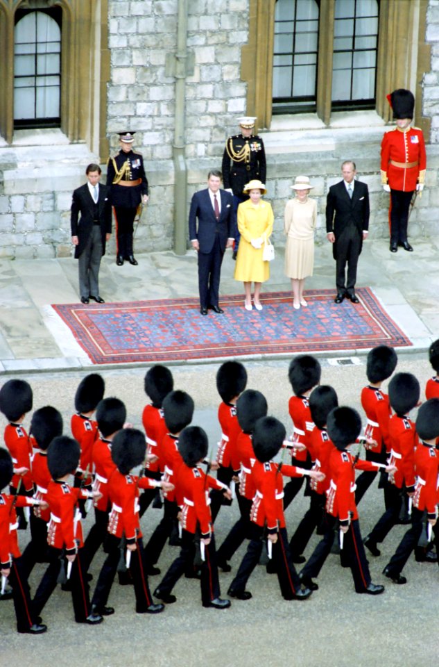 President Ronald Reagan, Nancy Reagan, Queen Elizabeth II, Prince Philip, and Prince Charles reviewing troops at Windsor Castle during trip to the United Kingdom