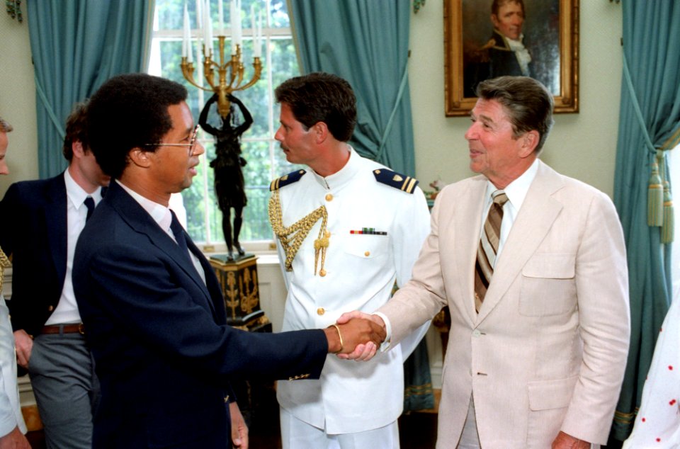 President Ronald Reagan shaking hands with Arthur Ashe