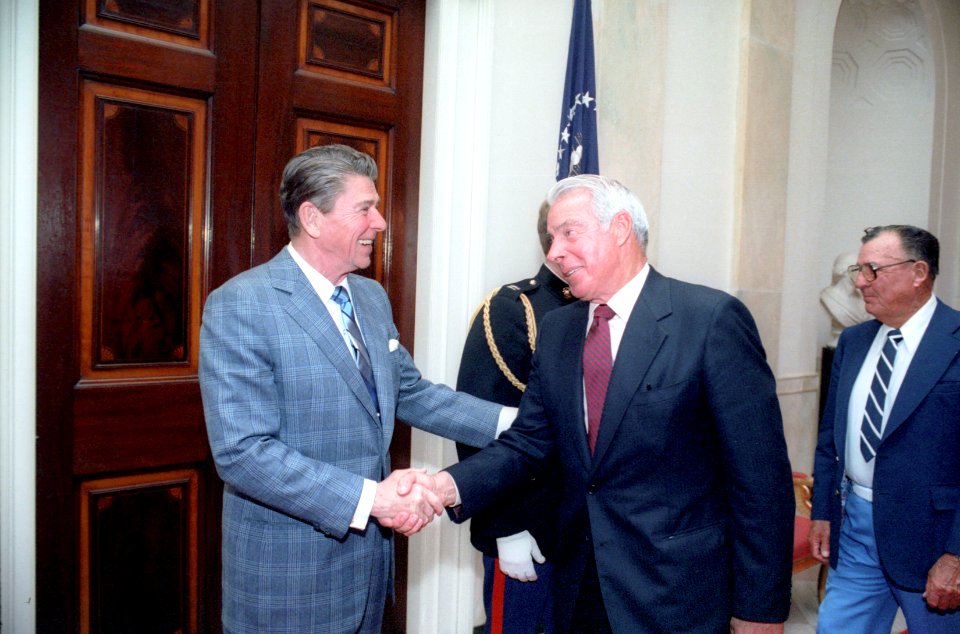 President Ronald Reagan shaking hands with Joe DiMaggio