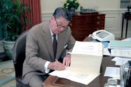 President Ronald Reagan signing H.R. 4170 the Deficit Reduction Act of 1984 in the Oval Office photo