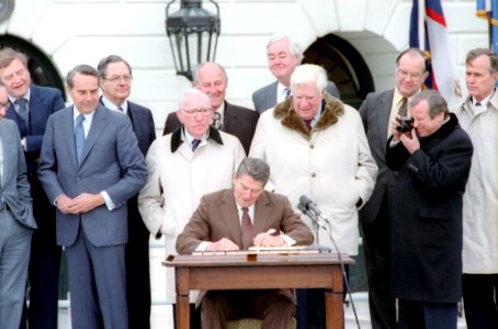 President Ronald Reagan Signing The Social Security Amendments Act of 1983 photo