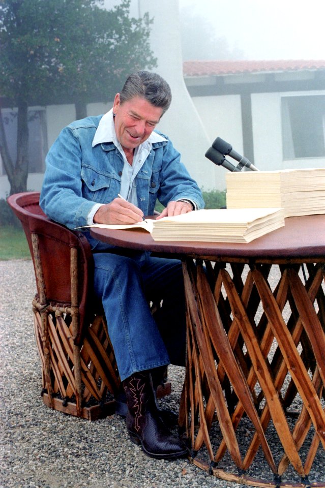 President Ronald Reagan Signs the 1981 Economic Recovery Tax Act and Omnibus Budget Reconciliation Act at Rancho Del Cielo in California