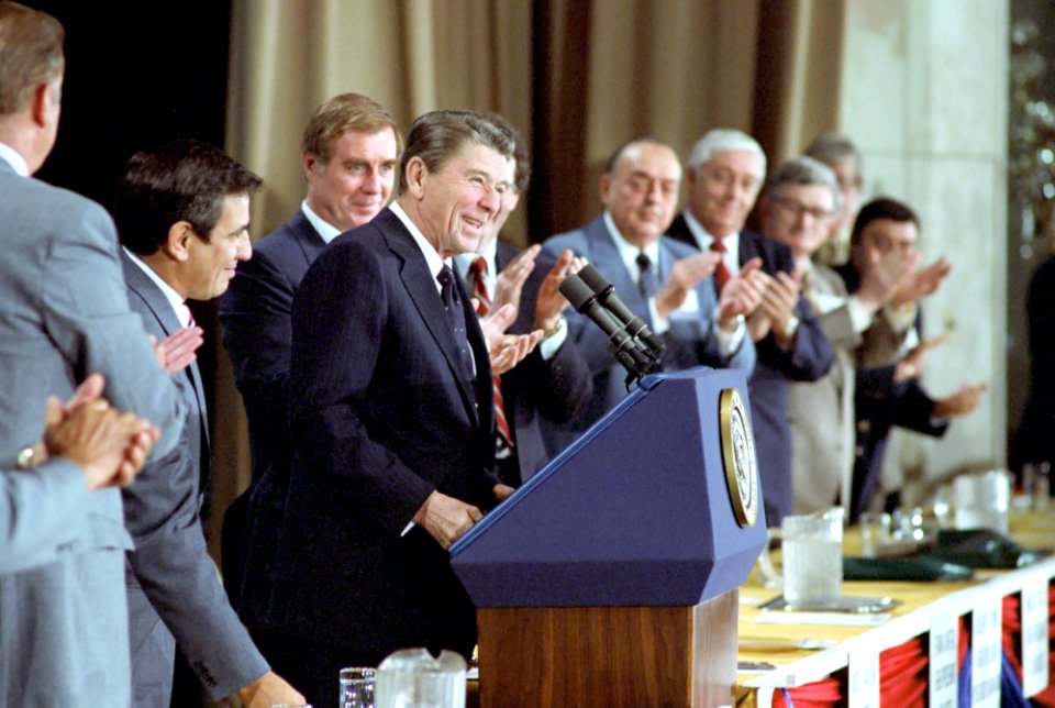 President Ronald Reagan speaking at a podium
