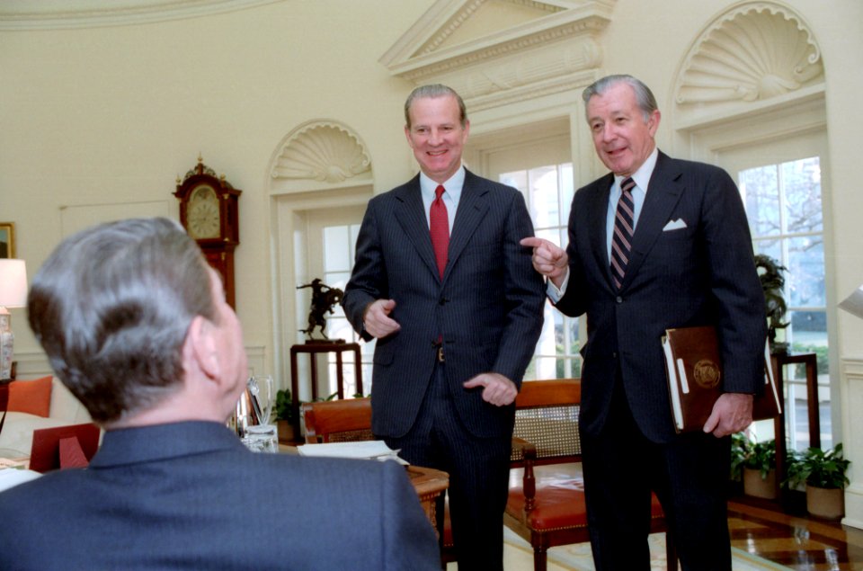 President Ronald Reagan talking to James Baker and Don Regan