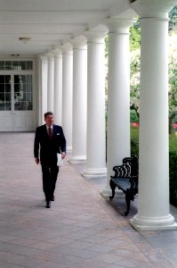 President Ronald Reagan walking along the colonnade the morning after the Libya air strike