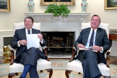 President Ronald Reagan with George H. W. Bush during a National Security Council briefing