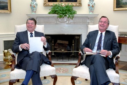 President Ronald Reagan with George H. W. Bush during a National Security Council briefing photo