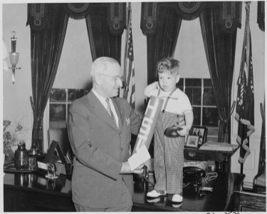 President Truman greets little Michael Gene Condatore of Washington in the oval office. Little Michael presented to... - NARA - 199724