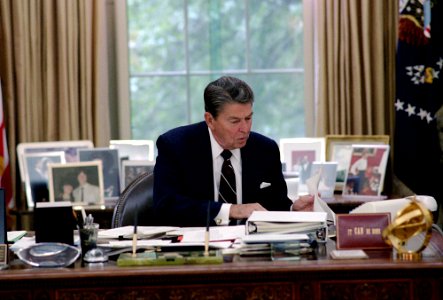 President Ronald Reagan Working in The Oval Office photo