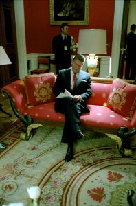 President Ronald Reagan writing in the Red Room before a press conference