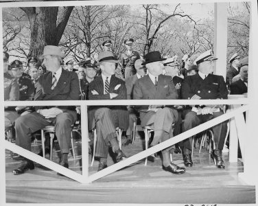 President Truman in the reviewing stand watching the Army Day parade in Washington, D. C. L to R, Secretary of the... - NARA - 199776 photo