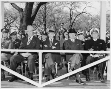 President Truman seated at the reviewing stand for Army Day in Washington, D. C. L to R, Two unidentified officers... - NARA - 199766