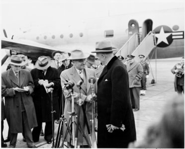 President Truman shaking hands with Secretary of State George Marshall at the National Airport in Washington, D. C.... - NARA - 199674 photo