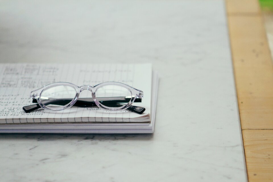 Eyeglasses gray paper gray table