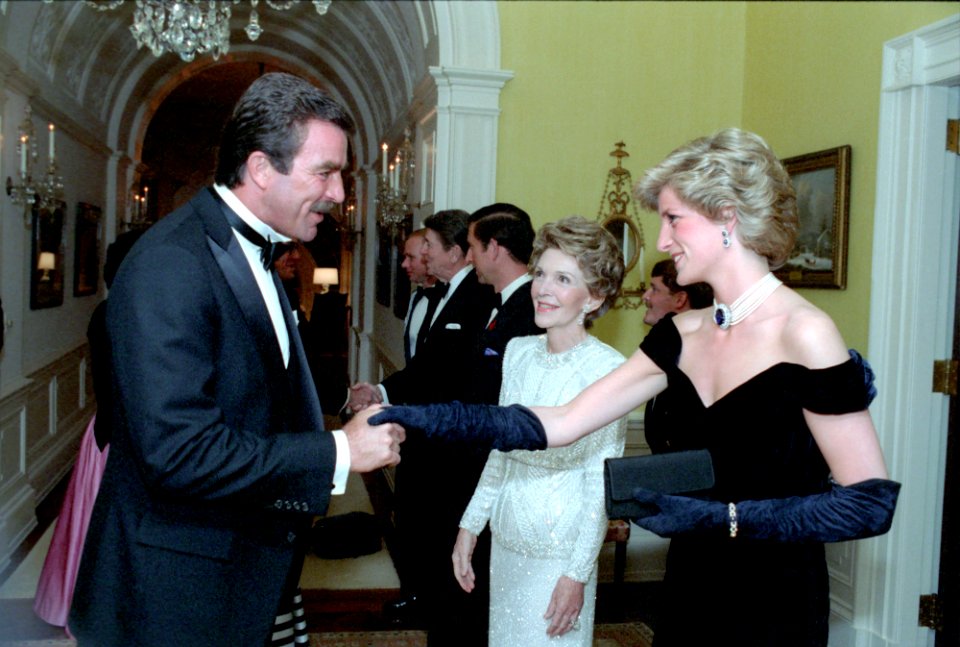 Princess Diana is greeted by Tom Selleck