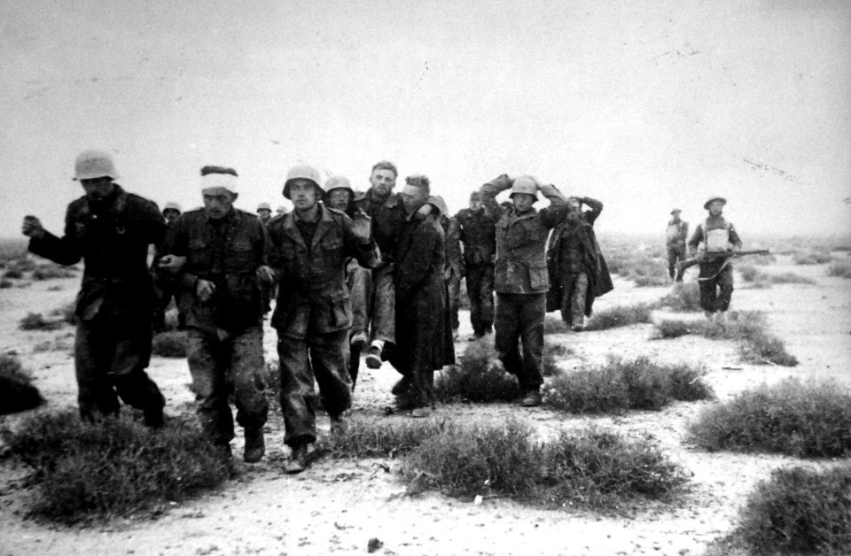 Prisoners coming into Tobruk, Lybia under British armed escort 1941(24317489611)