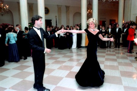 Princess Diana dancing with John Travolta in Cross Hall at the White House photo