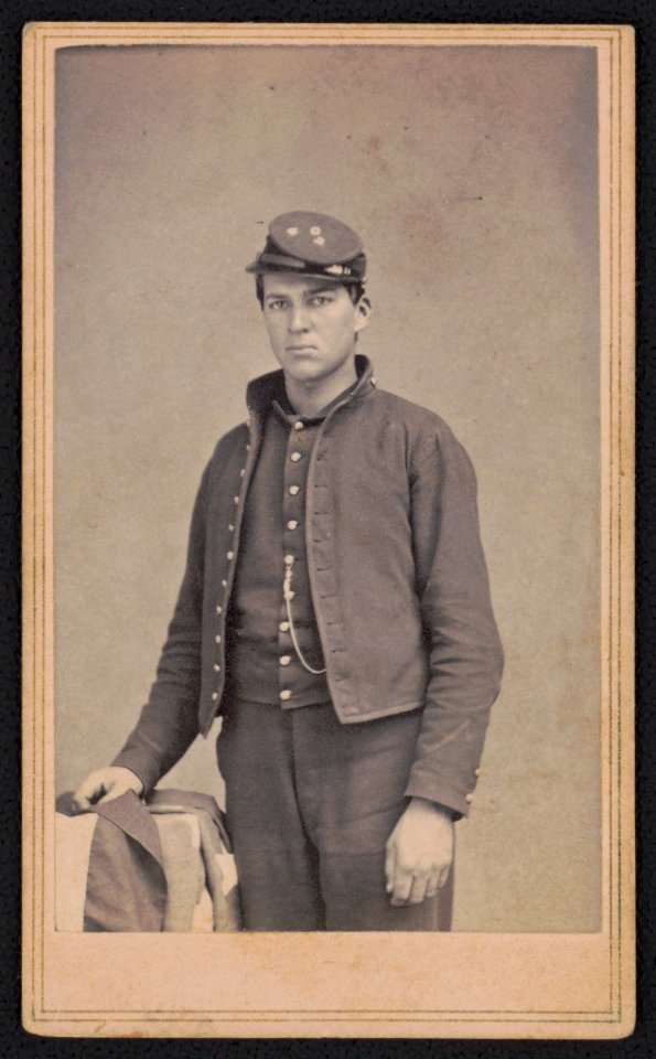 Private Thomas Dennis of Co. G, 2nd New York Cavalry Regiment in uniform with American flag LOC ppmsca.52246