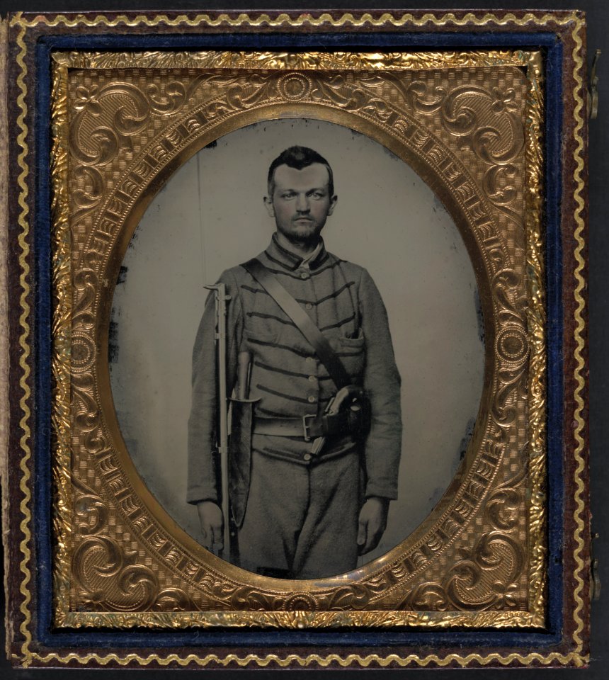Private John G. Lee of Company H, 18th Virginia Infantry Regiment, with bayoneted musket, large Bowie knife, and percussion pistol LCCN2011661455