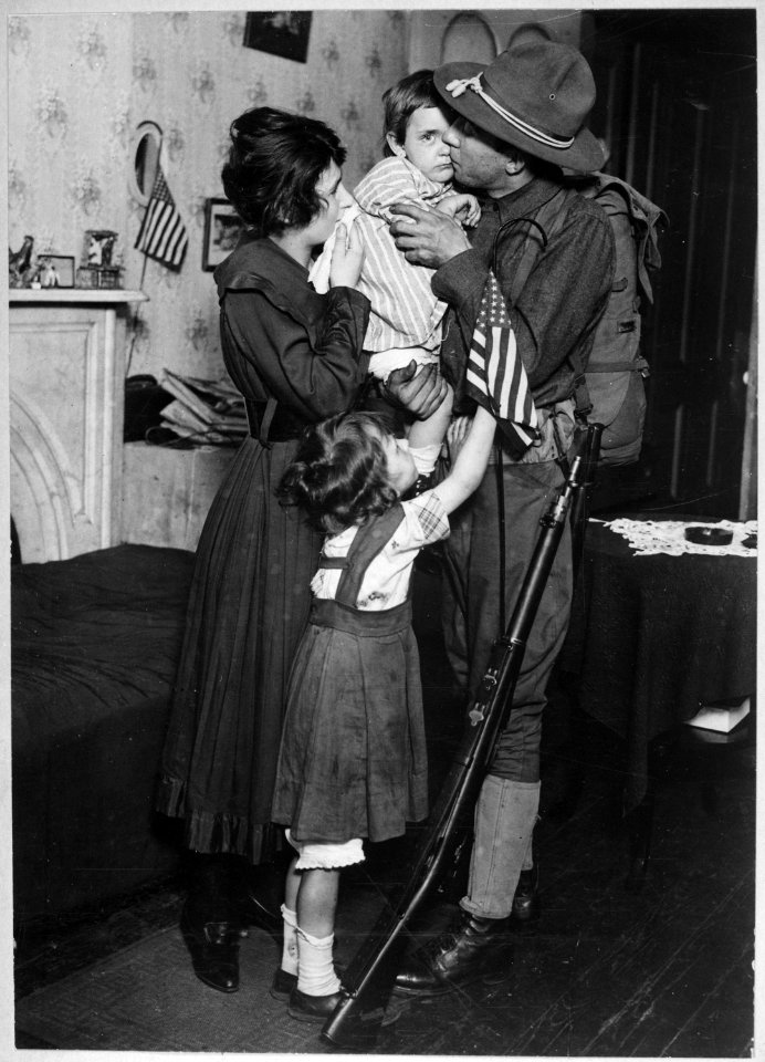 Private T. P. Loughlin of the 69th Regiment, New York National Guard, (165th Infantry) bidding his family farewell.... - NARA - 533683
