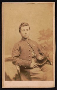 Private William Phelps McNeil of Co. H, 2nd New York Heavy Artillery Regiment, in uniform, in front of painted backdrop) - Palmer's Gallery, Mason's Island, D.C LCCN2017659624