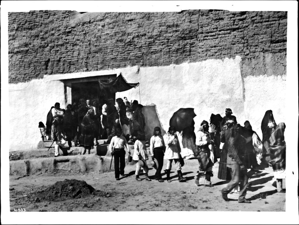 Procession leaving the church during the Fiesta de San Esteban (Saint Stephen), Acoma Pueblo, 1886 (CHS-4533)