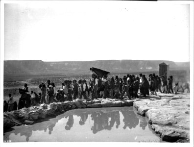 Procession of men next to the reservoir during the Fiesta de San Esteban (Saint Stephen), Acoma Pueblo, New Mexico, 1896 (CHS-4552)
